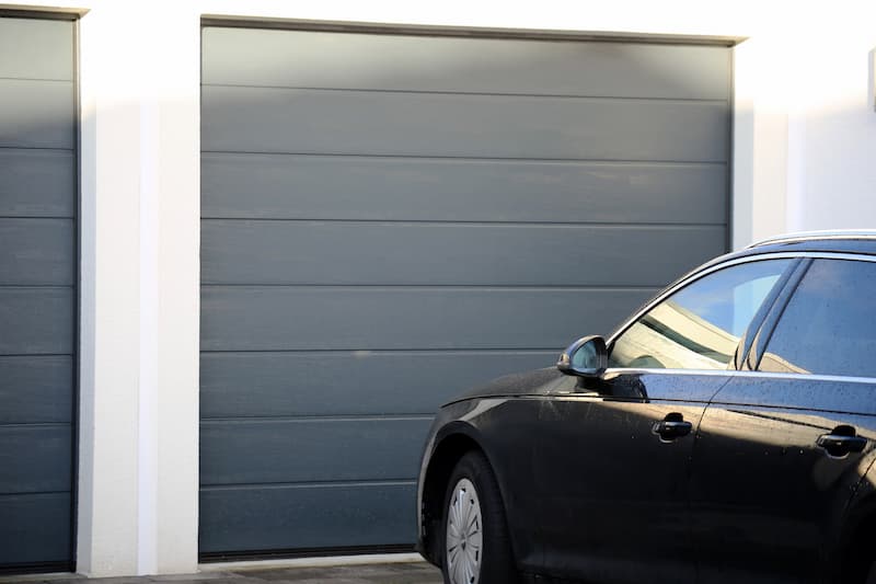 Black in front of double garage door